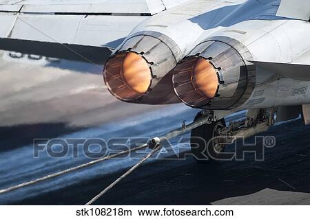 An F/A-18C Hornet catches an arresting gear wire. View Large Photo Image Picture - An F/A-18C Hornet catches an arresting gear wire.. Fotosearch