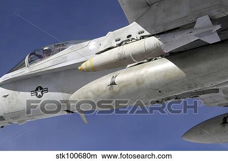 An F/A-18C Hornet flies over the Pacific Missile Range Facility. View Large Photo Image Picture - An F/A-18C Hornet flies over the Pacific Missile Range Facility.. Fotosearch