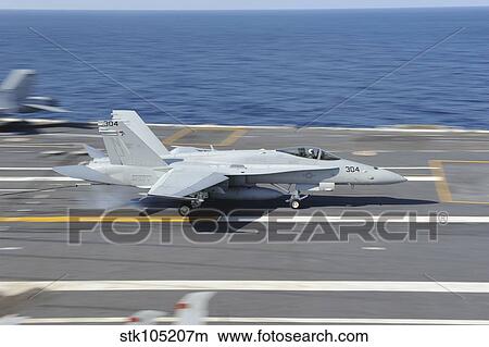 An F/A-18C Hornet lands aboard USS George H. W. Bush. View Large Photo Image Picture - An F/A-18C Hornet lands aboard USS George H. W. Bush.. Fotosearch