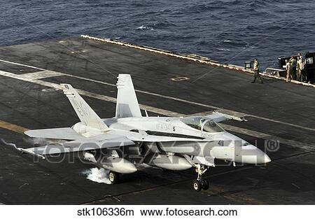 Picture - An F/A-18C Hornet lands on the flight deck of USS Abraham Lincoln.. Fotosearch