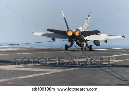 Picture - An F/A-18C Hornet lands on the flight deck of USS Harry S. Truman.. Fotosearch