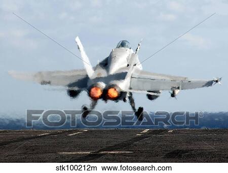 An F/A-18C Hornet launches from the flight deck of USS Enterprise. View Large Photo Image Picture - An F/A-18C Hornet launches from the flight deck of USS Enterprise.. Fotosearch