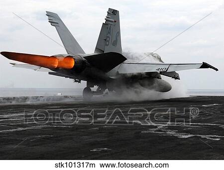 An F/A-18C Hornet launches from the flight deck aboard USS Enterprise. View Large Photo Image Picture - An F/A-18C Hornet launches from the flight deck aboard USS Enterprise.. Fotosearch