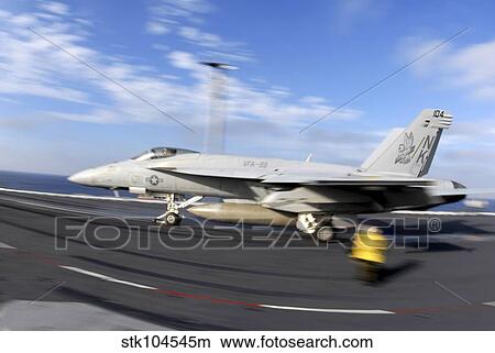 An F/A-18C Hornet launches from the flight deck aboard USS Nimitz. View Large Photo Image Picture - An F/A-18C Hornet launches from the flight deck aboard USS Nimitz.. Fotosearch