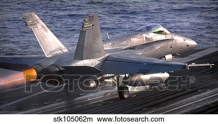 Picture - An F/A-18C Hornet launches from the Nimitz-class aircraft carrier USS Carl Vinson.. Fotosearch