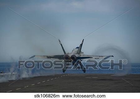 Picture - An F/A-18C Hornet launches from the flight deck of USS Carl Vinson.. Fotosearch