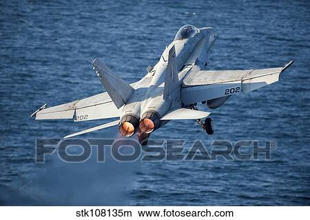 An F/A-18C Hornet launches from the flight deck of USS Harry S. Truman. View Large Photo Image Picture - An F/A-18C Hornet launches from the flight deck of USS Harry S. Truman.. Fotosearch