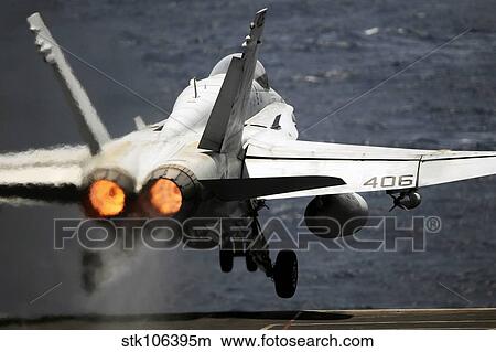 An F/A-18C Hornet launches from USS Abraham Lincoln. View Large Photo Image Picture - An F/A-18C Hornet launches from USS Abraham Lincoln.. Fotosearch