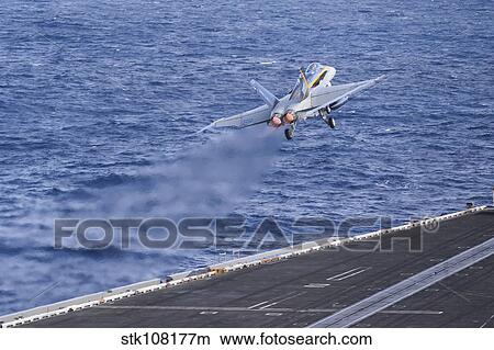 An F/A-18C Hornet launches from USS Nimitz. View Large Photo Image Picture - An F/A-18C Hornet launches from USS Nimitz.. Fotosearch
