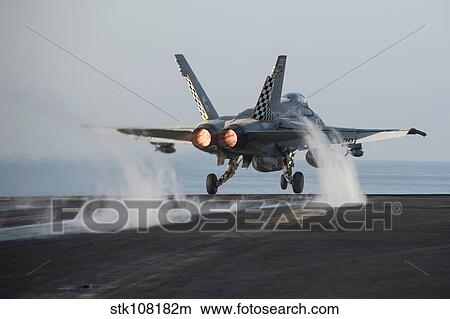 An F/A-18C Hornet launches from USS Harry S. Truman. View Large Photo Image Picture - An F/A-18C Hornet launches from USS Harry S. Truman.. Fotosearch