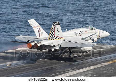 An F/A-18C Hornet launches from USS Harry S. Truman. View Large Photo Image Picture - An F/A-18C Hornet launches from USS Harry S. Truman.. Fotosearch