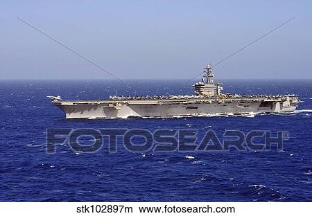 An F/A-18C Hornet launches off the flight deck of aircraft carrier USS Dwight D. Eisenhower. View Large Photo Image Picture - An F/A-18C Hornet launches off the flight deck of aircraft carrier USS Dwight D. Eisenhower.. Fotosearch