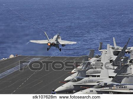Picture - An F/A-18C Hornet launches off the flight deck of USS Dwight D. Eisenhower.. Fotosearch