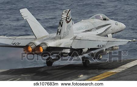 An F/A-18C Hornet launches off the flight deck of USS Nimitz. View Large Photo Image Picture - An F/A-18C Hornet launches off the flight deck of USS Nimitz.. Fotosearch