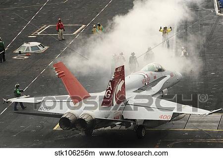 An F/A-18C Hornet prepares to launch from the flight deck of USS Dwight D. Eisenhower. View Large Photo Image Picture - An F/A-18C Hornet prepares to launch from the flight deck of USS Dwight D. Eisenhower.. Fotosearch