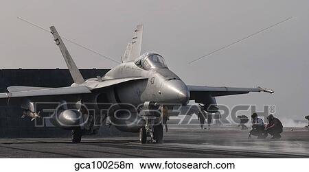 An F/A-18C Hornet ready to launch from the flight deck of USS George H. W. Bush. View Large Photo Image Picture - An F/A-18C Hornet ready to launch from the flight deck of USS George H. W. Bush.. Fotosearch