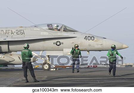 An F/A-18C Hornet ready to launch from a catapult board USS Theodore Roosevelt. View Large Photo Image Picture - An F/A-18C Hornet ready to launch from a catapult board USS Theodore Roosevelt.. Fotosearch