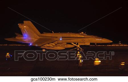 An F/A-18C Hornet ready to launch aboard USS George H. W. Bush. View Large Photo Image Picture - An F/A-18C Hornet ready to launch aboard USS George H. W. Bush.. Fotosearch