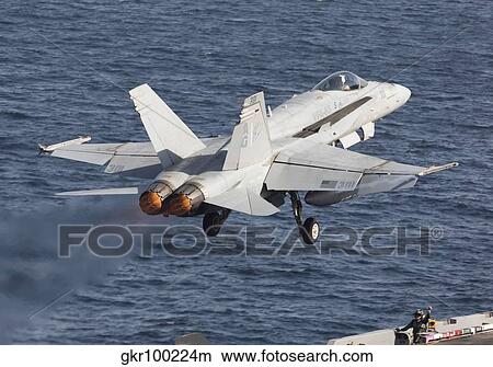 An F/A-18C Hornet taking off during flight operations on USS Dwight D. Eisenhower. View Large Photo Image Picture - An F/A-18C Hornet taking off during flight operations on USS Dwight D. Eisenhower.. Fotosearch