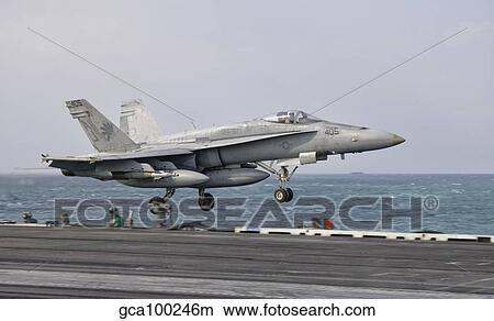 An F/A-18C Hornet taking off from the flight deck of USS George H. W. Bush. View Large Photo Image Picture - An F/A-18C Hornet taking off from the flight deck of USS George H. W. Bush.. Fotosearch