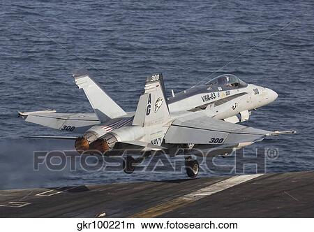 An F/A-18C Hornet taking off from the flight deck of USS Dwight D. Eisenhower. View Large Photo Image Picture - An F/A-18C Hornet taking off from the flight deck of USS Dwight D. Eisenhower.. Fotosearch