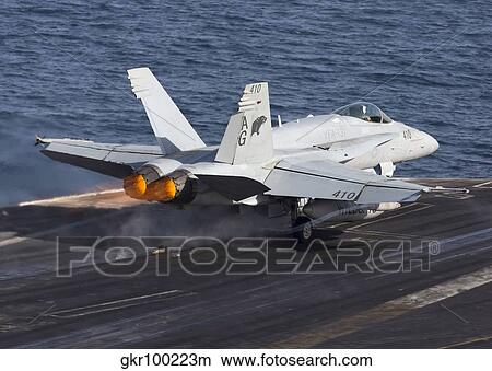 Picture - An F/A-18C Hornet taking off from the flight deck of USS Dwight D. Eisenhower.. Fotosearch