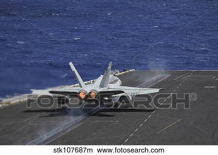 An F/A-18C Hornet taking off from USS Dwight D. Eisenhower. View Large Photo Image Picture - An F/A-18C Hornet taking off from USS Dwight D. Eisenhower.. Fotosearch