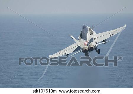 Picture - An F/A-18C Hornet taking off.. Fotosearch