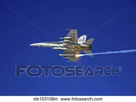 An F/A-18C Hornet testing its flare countermeasures system prior to heading into Iraq. View Large Photo Image Picture - An F/A-18C Hornet testing its flare countermeasures system prior to heading into Iraq.. Fotosearch