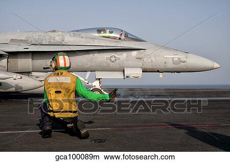 An F/A-18C is ready to launch from the flight deck of USS Eisenhower. View Large Photo Image Picture - An F/A-18C is ready to launch from the flight deck of USS Eisenhower.. Fotosearch