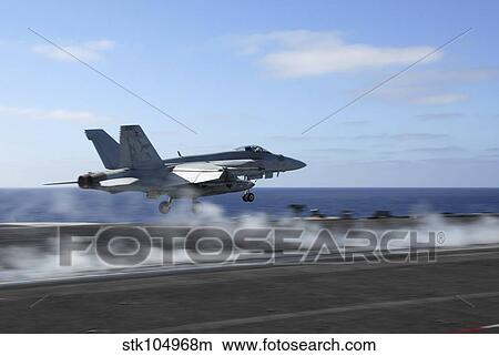 An F/A-18E Super Hornet catapults from the aircraft carrier USS Ronald Reagan. View Large Photo Image Picture - An F/A-18E Super Hornet catapults from the aircraft carrier USS Ronald Reagan.. Fotosearch