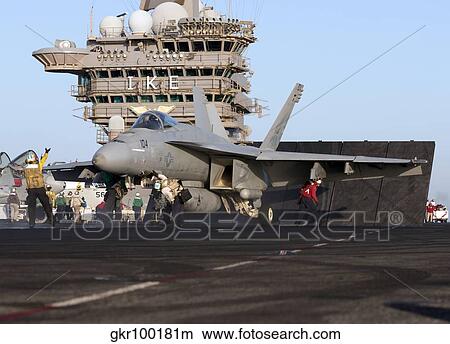 Picture - An F/A-18E Super Hornet during flight operations on USS Dwight D. Eisenhower. Fotosearch