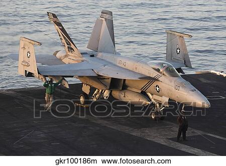 An F/A-18E Super Hornet during flight operations on USS Dwight D. Eisenhower. View Large Photo Image Picture - An F/A-18E Super Hornet during flight operations on USS Dwight D. Eisenhower.. Fotosearch