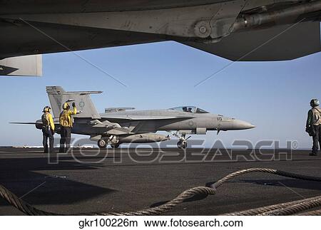 An F/A-18E Super Hornet during flight operations on USS Dwight D. Eisenhower. View Large Photo Image Picture - An F/A-18E Super Hornet during flight operations on USS Dwight D. Eisenhower.. Fotosearch