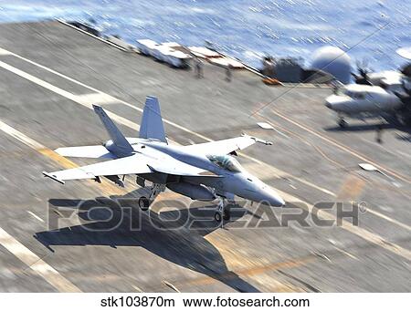 An F/A-18E Super Hornet lands aboard the aircraft carrier USS Enterprise. View Large Photo Image Picture - An F/A-18E Super Hornet lands aboard the aircraft carrier USS Enterprise.. Fotosearch