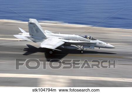 An F/A-18E Super Hornet lands aboard USS Dwight D. Eisenhower. View Large Photo Image Picture - An F/A-18E Super Hornet lands aboard USS Dwight D. Eisenhower.. Fotosearch