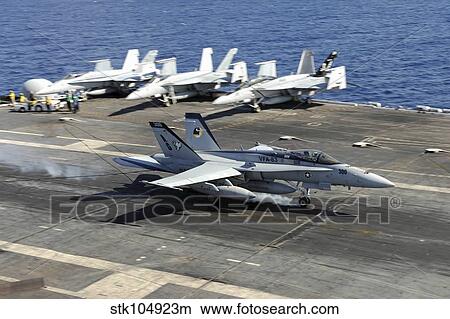 An F/A-18E Super Hornet lands aboard the aircraft carrier USS Dwight D. Eisenhower. View Large Photo Image Picture - An F/A-18E Super Hornet lands aboard the aircraft carrier USS Dwight D. Eisenhower.. Fotosearch