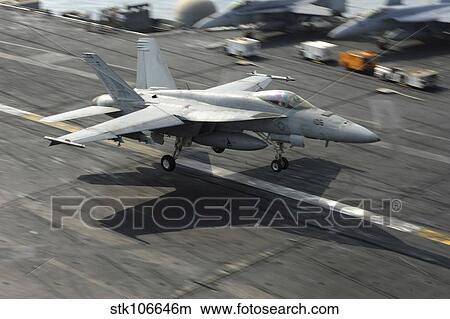 Picture - An F/A-18E Super Hornet lands aboard USS Dwight D. Eisenhower.. Fotosearch