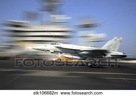 An F/A-18E Super Hornet lands aboard USS Dwight D. Eisenhower. View Large Photo Image Picture - An F/A-18E Super Hornet lands aboard USS Dwight D. Eisenhower.. Fotosearch