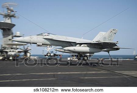 An F/A-18E Super Hornet lands aboard USS Harry S. Truman. View Large Photo Image Picture - An F/A-18E Super Hornet lands aboard USS Harry S. Truman.. Fotosearch