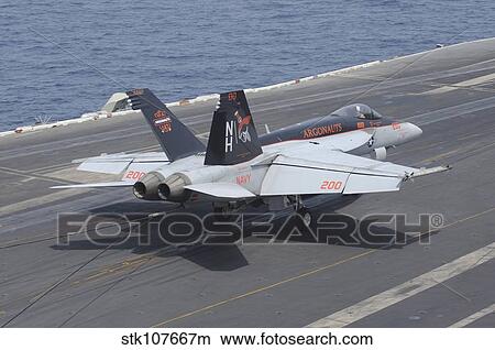 An F/A-18E Super Hornet lands on the flight deck of USS Nimitz. View Large Photo Image Picture - An F/A-18E Super Hornet lands on the flight deck of USS Nimitz.. Fotosearch