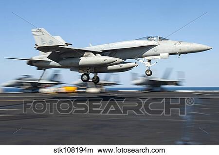 An F/A-18E Super Hornet lands on the flight deck of USS Harry S. Truman. View Large Photo Image Picture - An F/A-18E Super Hornet lands on the flight deck of USS Harry S. Truman.. Fotosearch