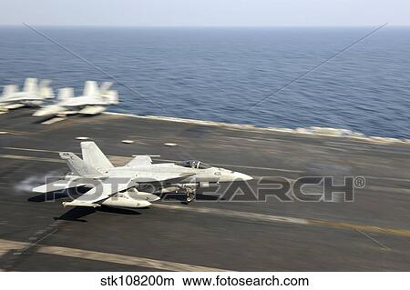 Picture - An F/A-18E Super Hornet lands on the flight deck of USS Harry S. Truman.. Fotosearch