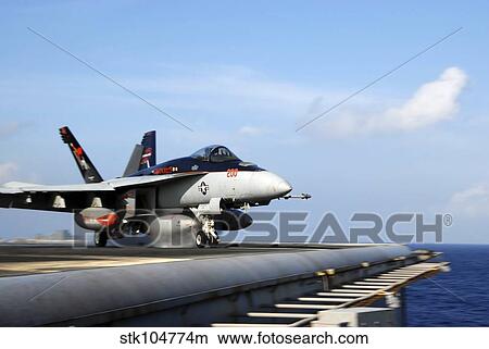 An F/A-18E Super Hornet launches from the aircraft carrier USS Ronald Reagan. View Large Photo Image Picture - An F/A-18E Super Hornet launches from the aircraft carrier USS Ronald Reagan.. Fotosearch