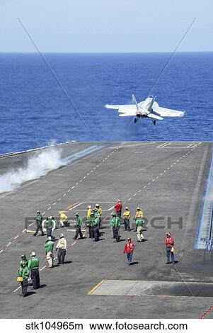 An F/A-18E Super Hornet launches from the aircraft carrier USS Ronald Reagan. View Large Photo Image Picture - An F/A-18E Super Hornet launches from the aircraft carrier USS Ronald Reagan.. Fotosearch