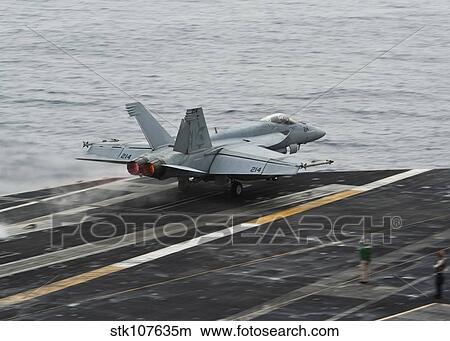 An F/A-18E Super Hornet launches from the flight deck of USS Nimitz. View Large Photo Image Picture - An F/A-18E Super Hornet launches from the flight deck of USS Nimitz.. Fotosearch