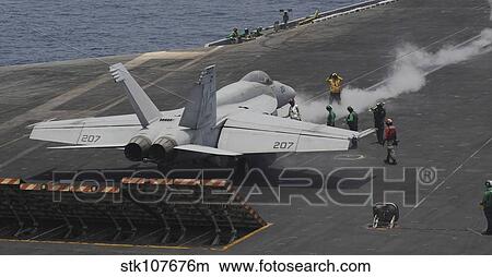 An F/A-18E Super Hornet launches from USS Nimitz. View Large Photo Image Picture - An F/A-18E Super Hornet launches from USS Nimitz.. Fotosearch