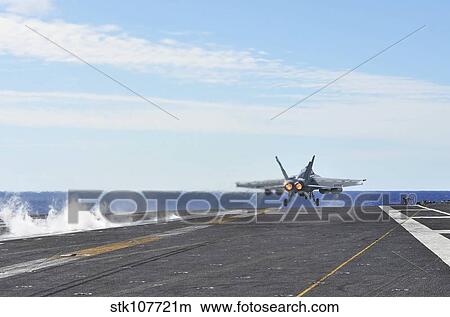 An F/A-18E Super Hornet launches from the flight deck of USS George Washington. View Large Photo Image Picture - An F/A-18E Super Hornet launches from the flight deck of USS George Washington.. Fotosearch