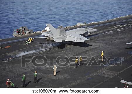 Picture - An F/A-18E Super Hornet launches from USS Nimitz.. Fotosearch