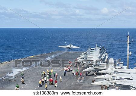 Picture - An F/A-18E Super Hornet launches from the flight deck of USS George Washington.. Fotosearch